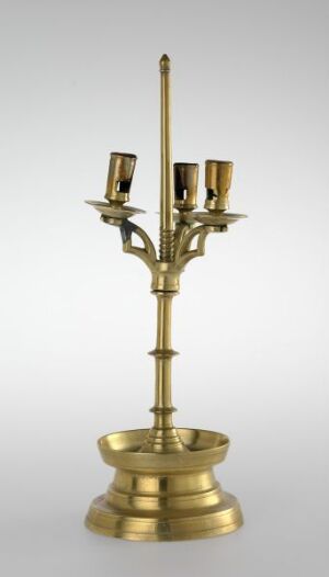  "Kandelaber" by an unidentified artist, featuring a golden cast brass candelabra with multiple candle holders branching out from a central stem against a subtle gradient background, symbolizing refined and classical design in lighting fixtures.