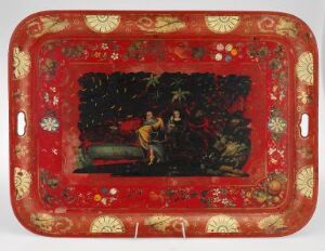  A vintage tray with a lustrous deep red background and intricate white medallions around the border. The center features a dark, shadowed scene with two figures, one holding a stringed instrument, surrounded by flora.