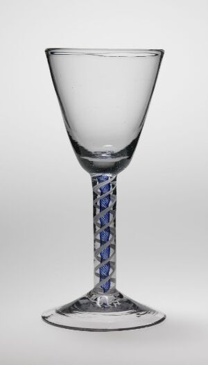  An elegant clear glass goblet with a cone-shaped bowl and a slender stem featuring a spiral blue and white design, set against a light gray background.