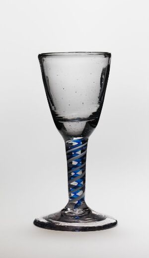  A clear glass goblet with blue and white spiral decorations on the stem, set against a light gray background.