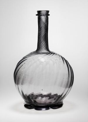  A transparent grey glass bottle with a bulbous base and long, narrow neck featuring vertical ridges on the lower half and a braid-like textured pattern on the upper half against a neutral background.