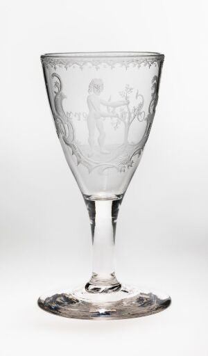  A clear glass goblet with a classical, etched design depicting a woman, placed against a white background.