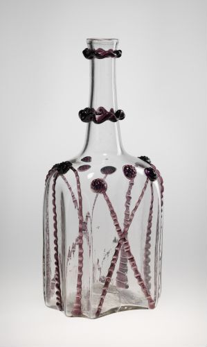 Alt-Text: A clear glass decorative bottle by Gjøvik Verk, featuring a textured pattern with purple circular accents and dark glass rings around the neck against a neutral background.