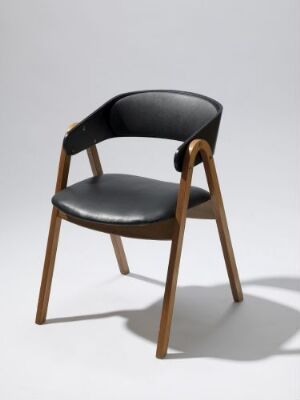  "Engølinjen Armstol B" by Bjørn Engø, a mid-century modern armchair made of form-bent teak and beech laminate, partially black lacquered, with a seat and curved backrest upholstered in black leather, set against a neutral background.