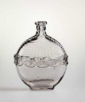  A clear glass bottle with a rounded, flattened body featuring a decorative loop pattern around its center and a textured upper half with raised dots. The bottle has a narrow neck and small side handles, set against a light gray background. Artist and title unknown.