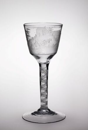  A clear engraved glass goblet by Hurdal glassverk, with a flared bowl featuring delicate designs, a spirally textured stem, and a sturdy base, set against a light gray background.