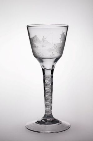  A clear engraved glass goblet by Villas Hansen Vinter with a helix pattern on the stem and a wintery scene on the bowl, set against a light-to-dark gradient background.