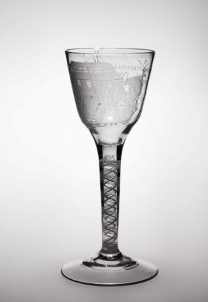  A clear glass with an intricate stem design partially filled with water, set against a soft gradient background transitioning from white to light gray.