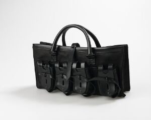  "Ring Tab Hand Bag" by Helmut Lang - a black linen handbag with a unique pattern