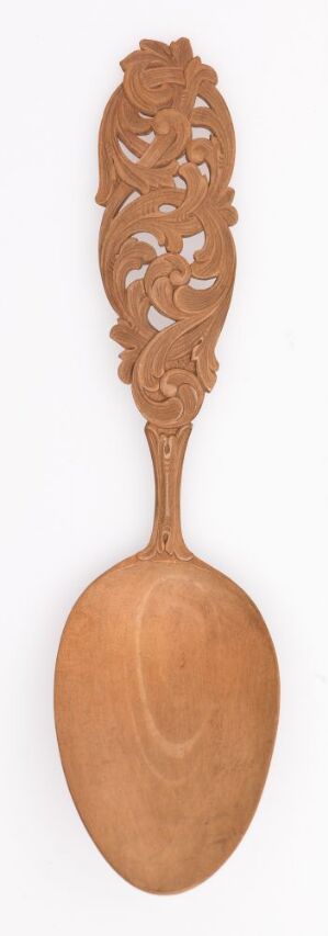  An intricately carved wooden spoon with a long decorative handle featuring openwork leaf or floral motifs, and a smooth oval bowl, all in a light brown tone. Artist name and title unknown.