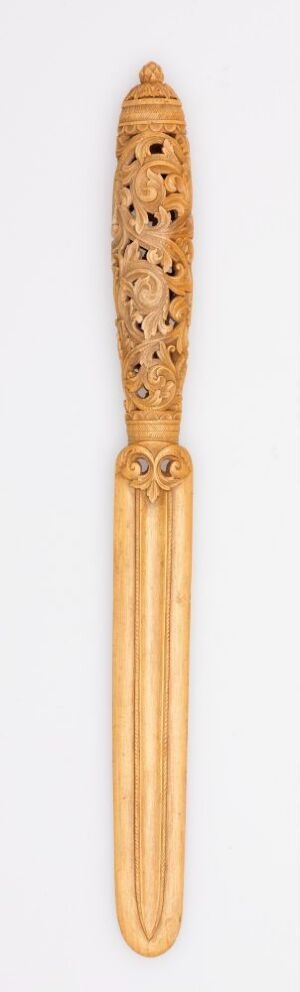  A slender wooden object resembling a traditional hairbrush, with a cylindrical handle and a brush head with rows of small, bristle-less holes against a light background. Artistname and title are unknown.