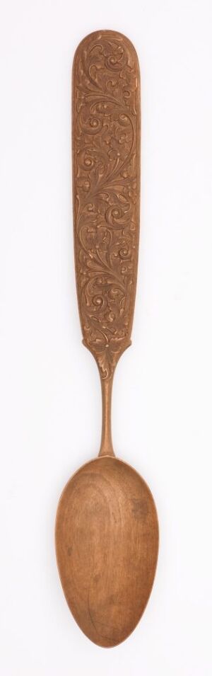  A slender, wooden spoon with a long handle and a circular bowl at the bottom, displaying a warm brown color palette with visible wood grain details, set against a neutral background. Artist and title are unknown.