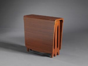 
 A modern, dark brown wooden cabinet or side table with a striking design of four orange vertical slats on one side, standing on a light grey surface against a gradient grey background.