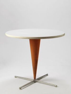  A modern table designed by Verner Panton titled "Kræmmerhusbord K (spesialbestilt)," featuring a white circular top, a tapering brown conical leg, and a star-shaped metallic base.