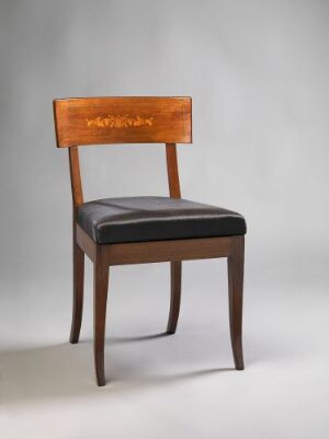  A classic wooden chair with dark brown legs and a lighter brown horizontal backrest, featuring a black upholstered seat against a plain light grey background.