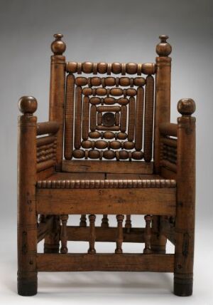 
 An intricately crafted traditional birchwood chair titled "Stolpestol fra