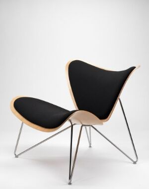  "Copenhagen" - a modern chair designed by Lars Tornøe, featuring a form-pressed oak veneer in a light honey color with varnish finish, upholstered in matte black wool, supported by forked chrome-plated steel legs, against an off-white background.