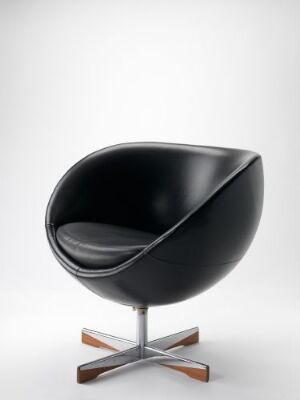  A designer chair by Møre Lenestolfabrikk with a half-egg shape in matte black faux leather. It features a chrome steel base with rosewood accents, set against a simple white background.