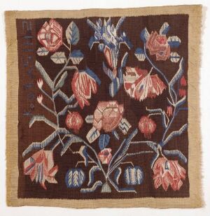  A square piece of fabric with a rich brown background showcasing a stylized botanical design with flowers in various shades of red, leaves and stems in blues and greens, and light beige branches, arranged in a vivid and dynamic composition.