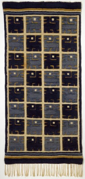  An elaborate navy blue and gold textile art piece with a grid of golden-bordered squares containing vine-like patterns on a navy background, framed with golden stripe edges, and a fringed bottom.