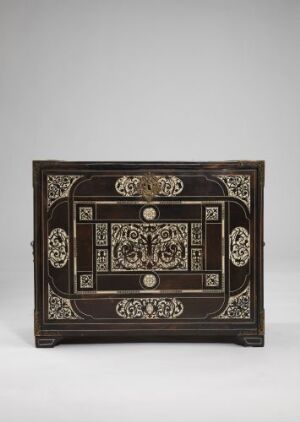  An ornate Kabinettskap cabinet made of dark Jacaranda wood, inlaid with ivory and ebony to create intricate patterns, adorned with brass fittings and handles, against a neutral background. Artist: Unidentified.