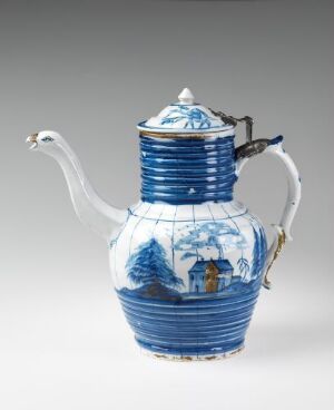  A porcelain teapot with cobalt blue and white coloring, featuring rib-like bands and a landscape scene with Eastern architectural structures. It has a curved spout, an ornate handle with a touch of gold, and a round finial on the lid.