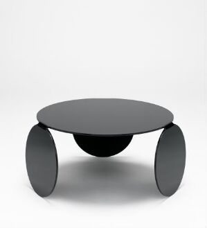  A modern matte black coffee table with a circular top and three thick cylindrical legs on a white background, exemplifying minimalist design.