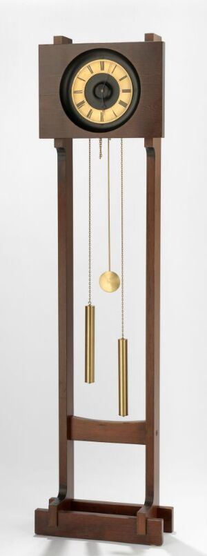  A tall, minimalist Sven Ivar Dysthe grandfather clock titled "Tyritre," made with varnished tyrifuru wood and brass components, featuring a black and brass clock face, brass pendulum, and weights, exuding a sophisticated balance of natural and metallic elements.