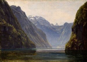  "Landskap med fjell" ("Landscape with Mountains") by Thomas Fearnley, an oil on paper mounted on wood panel painting, depicting a tranquil fjord flanked by steep cliffs covered with verdant trees, with distant snow-capped mountains under a soft-gradient sky, enhancing the natural splendor and serenity of the scene.