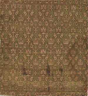 
 A low-resolution image of vintage-style fabric or wallpaper with a dark brown background and a repetitive burnt sienna pattern that resembles stylized botanical motifs.