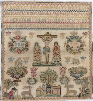  A photograph of a square textile artwork featuring a crucifixion scene in the center, surrounded by muted-colored animals, human figures, plants, and geometric patterns, indicative of traditional or folk embroidery.