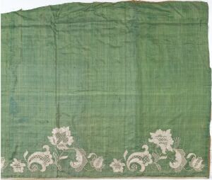  Antique textile fragment with a soft green background and a lighter decorative floral pattern along one border. The fabric shows signs of age with slight creases and natural wear. Artist name and title are unknown.