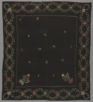  A textile with a dark, possibly black background featuring a colorful floral border in red, pink, yellow, and green, with scattered floral motifs within the central area. The contrast between the vibrant border and sparse interior decorations creates a visually striking piece. Artist name and title are unknown.