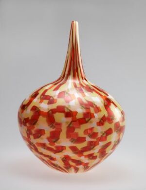  A handcrafted glass object by Vidar Koksvik with a rounded body and elongated stem, featuring a creamy white base with vibrant and muted red murrine patterns.