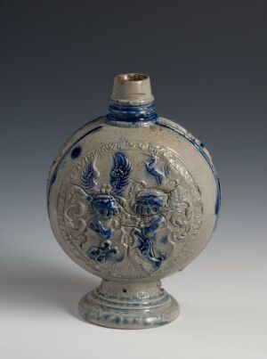  A spherical flask with a flat bottom and a short neck, featuring cobalt blue traditional designs on a white or light gray background with a band of gold coloring around the neck.