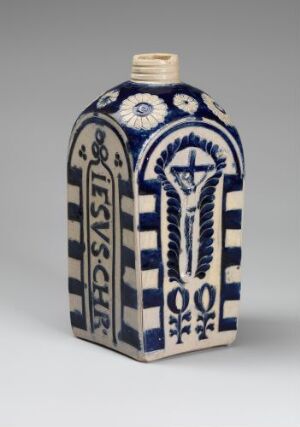  A rectangular, flat ceramic flask with a blue and white design featuring a crucifix and the inscriptions "IHS" and "S·P·Q·R" in cobalt blue on a white background, with an unglazed tan neck at the top.