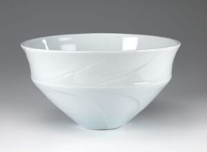  A white ceramic bowl with a smooth, glossy finish and faint white swirl patterns on a neutral gray background.