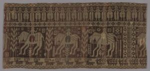  A horizontal, elongated textile featuring a series of intricate, earth-toned patterns with figures and animals, set against a warm tan background with decorative borders, showcasing traditional woven or embroidered artistry.