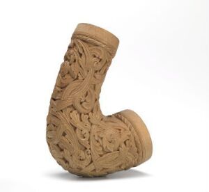  A finely carved, light brown traditional wooden tobacco pipe with intricate designs, displayed against a plain white background. (Artist name and title unknown)