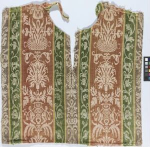  Antique textile panels with symmetrical patterns in green and muted brown on an off-white background, likely part of a historical garment, with a color scale reference for color accuracy.