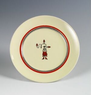  A ceramic plate by Egersunds Fayancefabrik featuring a creamy-yellow base with a red and black rim. At the center, there's a stylized red and black figure, possibly in traditional dress, giving the plate a distinctive and cultural design.