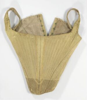  An antique, vertical boned, pale cream corset with darker binding on the edges and shoulder straps, displayed against a white background.