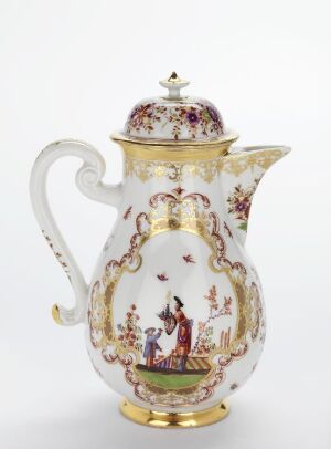  An ornately decorated porcelain coffee pot with a pastoral scene and gold accents.