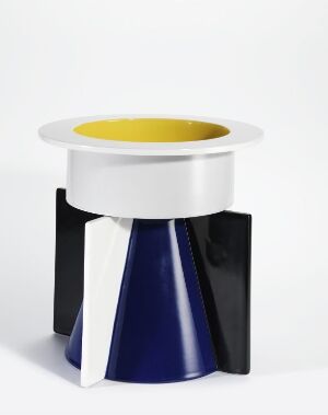  A porcelain decorative art object featuring geometric shapes with a white cylindrical top section, cobalt blue and white conical base, and a bright yellow glazed interior. The object showcases modernist design elements with a sleek and vivid color palette. Artist name and artwork title are unknown.