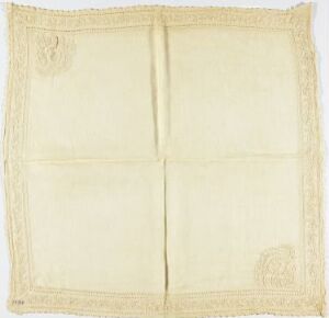  A square-shaped, pale yellow folded cloth with decorative spiral motifs in each corner, presented against a white background.