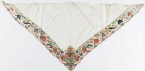  A triangular fabric piece with an off-white base and a colorful floral embroidered border featuring red, pink, orange, and green flowers with blue accents against an off-white background.