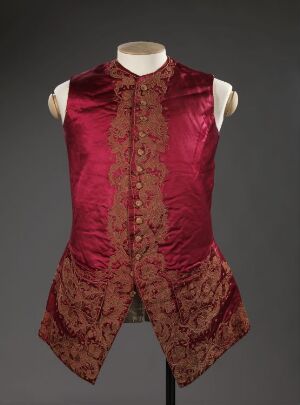  A sleeveless, deep red silk vest with ornate floral brocade detailing on the front, mounted on a mannequin torso against a dark gray background.