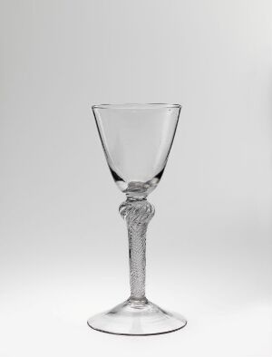  An elegant, clear glass goblet with a decorative twisted stem, set against a soft light gray background.