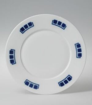  A white ceramic plate with a glossy finish and vibrant cobalt blue rectangular accents on the rim, presented against a gradient light grey to white background.