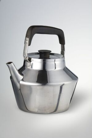  A stainless steel kettle designed by Jacob Jensen, known as "Bernadottekannan," with a sturdy black plastic handle, angular body, and slender spout set against a light background.